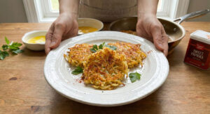 Crispy Cauliflower Hash Browns recipe  a healthy low carb and keto friendly breakfast served on a plate