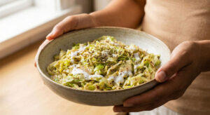 Keto friendly warm cabbage salad cooked in an air fryer with lemon and coconut cream dressing